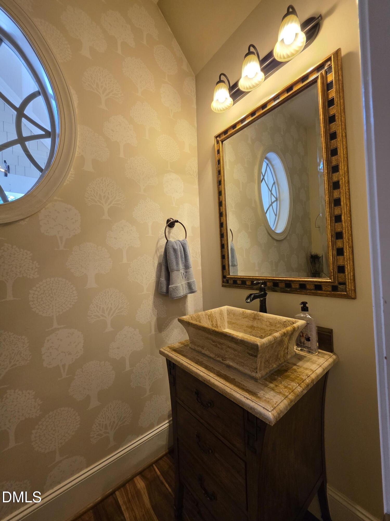 413 Johnson Town Road Zebulon, NC 27597 - Photo 30 of 42 a bathroom with a sink and a mirror