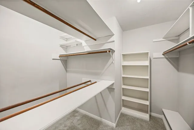 a white bath tub sitting next to a white sink