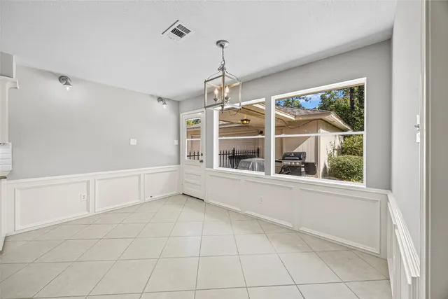 a kitchen with stainless steel appliances a sink stove and cabinets