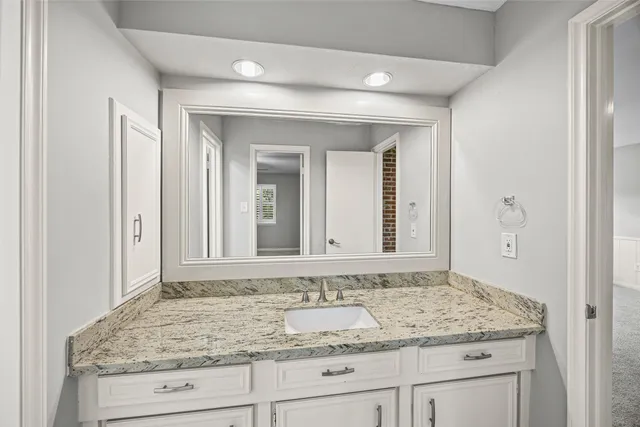 an empty room with a window and a ceiling fan