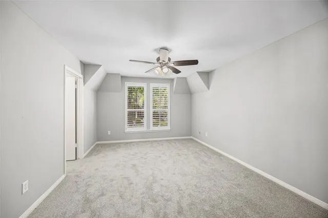 a bathroom with a bathtub and a toilet