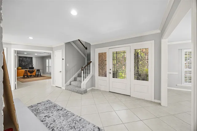 a view of a livingroom with workspace and a window
