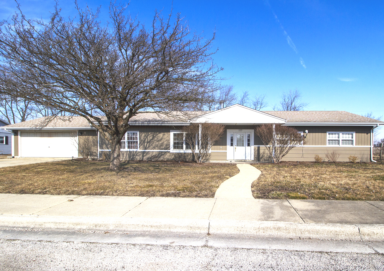 a front view of a house with a yard
