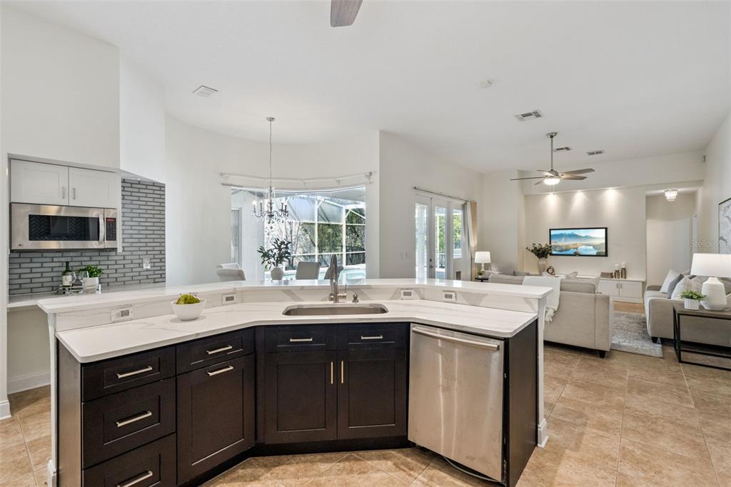 2541 Teton Stone Run Orlando, FL 32828 - Photo 28 of 82 a kitchen with a sink stove and cabinets