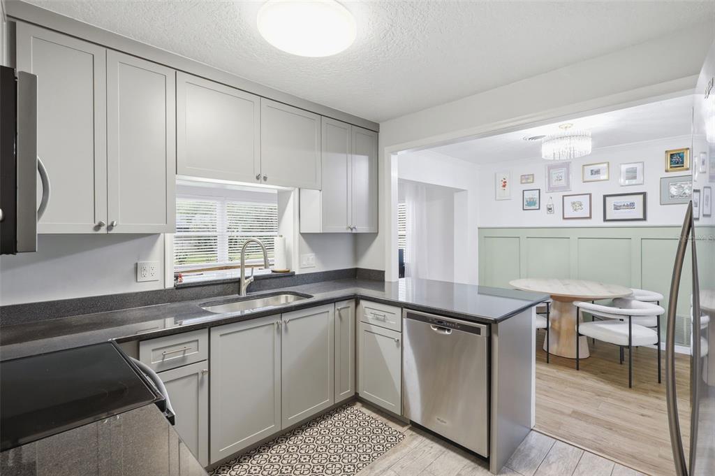 1291 Oxford Road Maitland, FL 32751 - Photo 13 of 37 a kitchen with a sink and cabinets