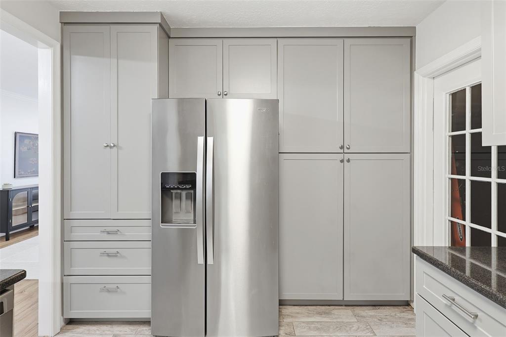 1291 Oxford Road Maitland, FL 32751 - Photo 16 of 37 a view of a kitchen with refrigerator and cabinet