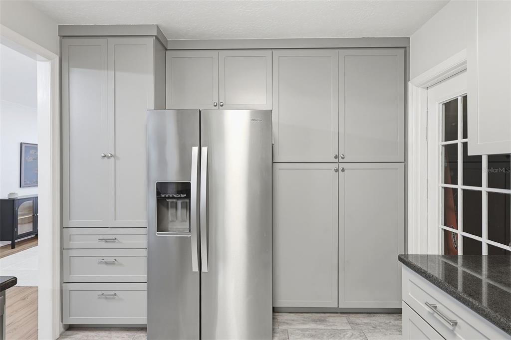 1291 Oxford Road Maitland, FL 32751 - Photo 17 of 37 a view of kitchen with refrigerator and cabinet