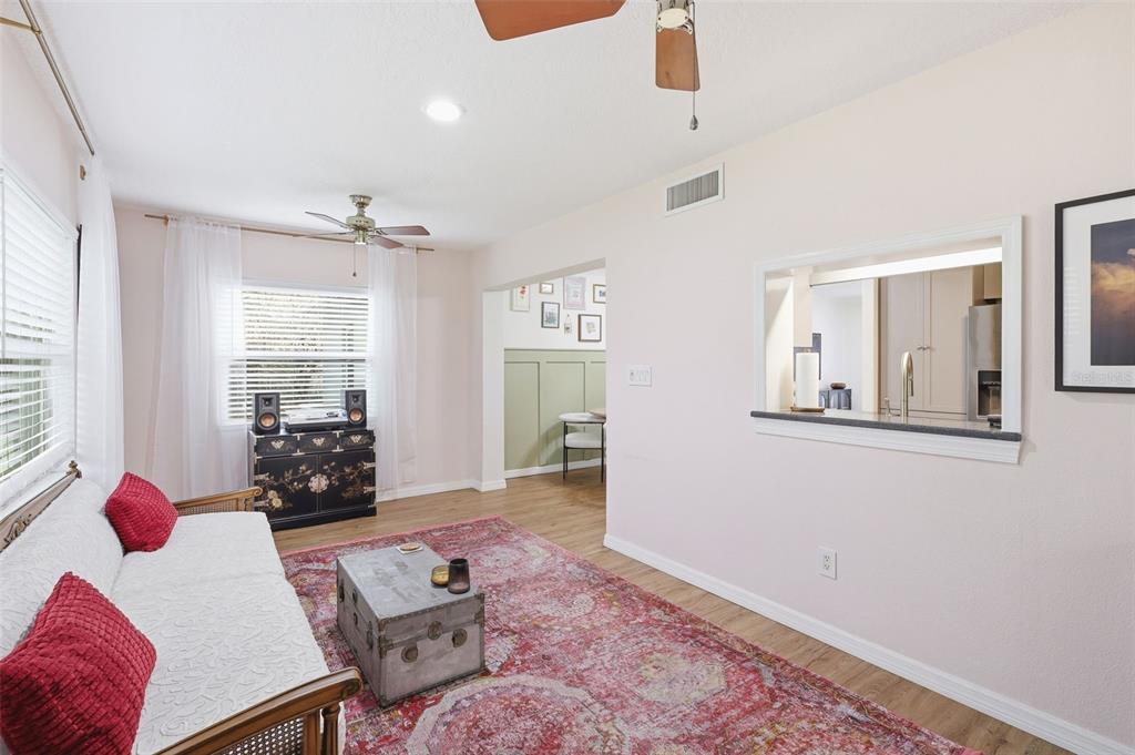 1291 Oxford Road Maitland, FL 32751 - Photo 24 of 37 a living room with furniture and two window