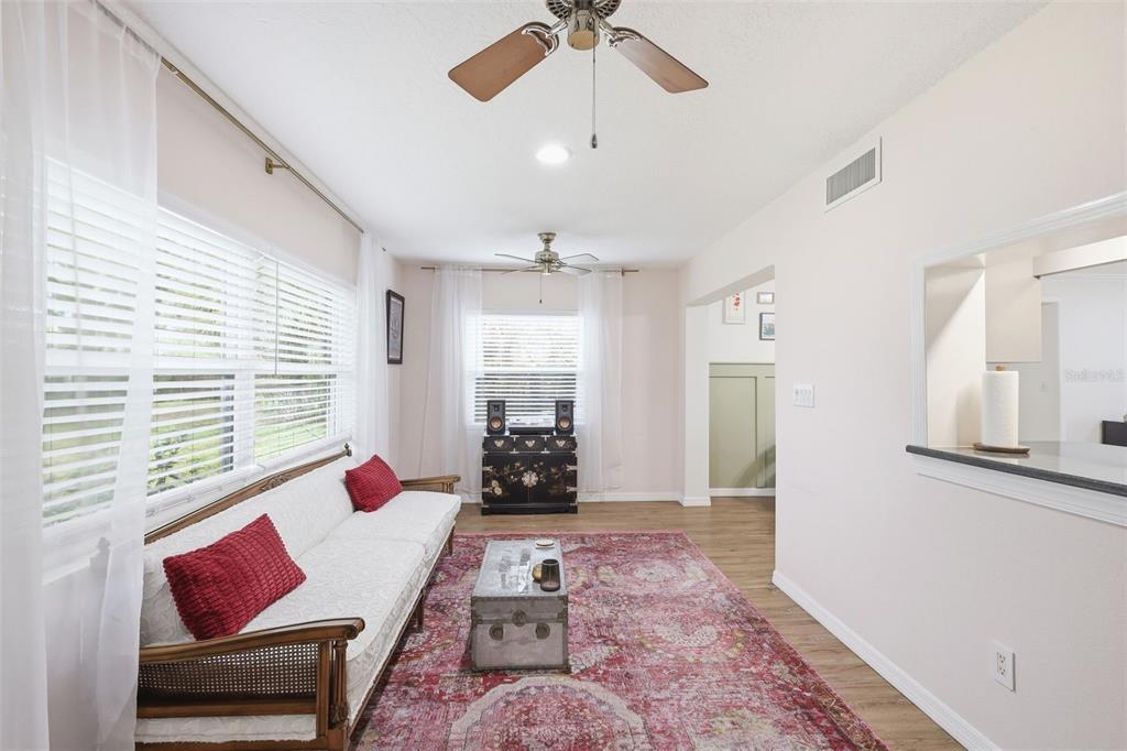 1291 Oxford Road Maitland, FL 32751 - Photo 25 of 37 a living room with furniture and wooden floor