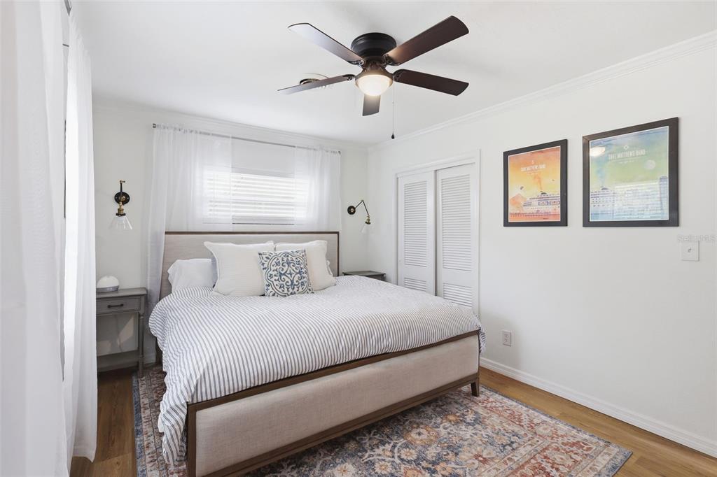 1291 Oxford Road Maitland, FL 32751 - Photo 27 of 37 a bedroom with a bed and a painting on the wall