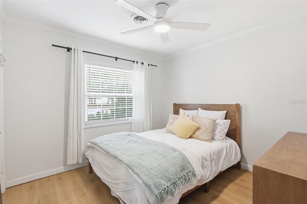 1291 Oxford Road Maitland, FL 32751 - Photo 31 of 37 a bedroom with a large bed and a chandelier