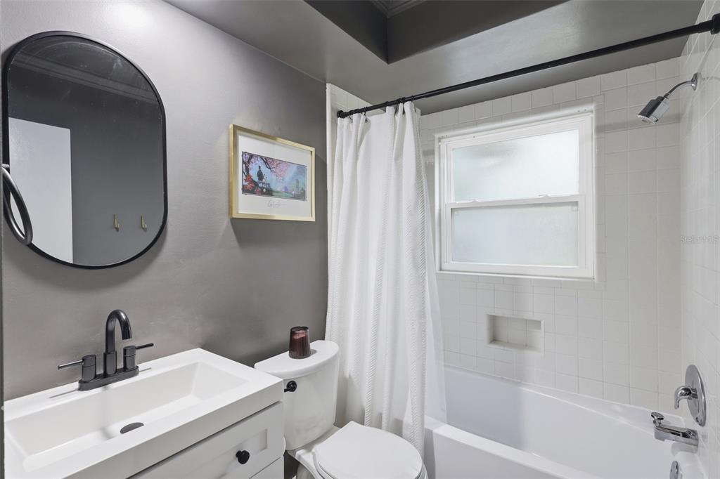 1291 Oxford Road Maitland, FL 32751 - Photo 32 of 37 a bathroom with a sink toilet and shower