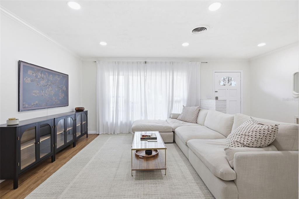 1291 Oxford Road Maitland, FL 32751 - Photo 8 of 37 a living room with furniture and a flat screen tv