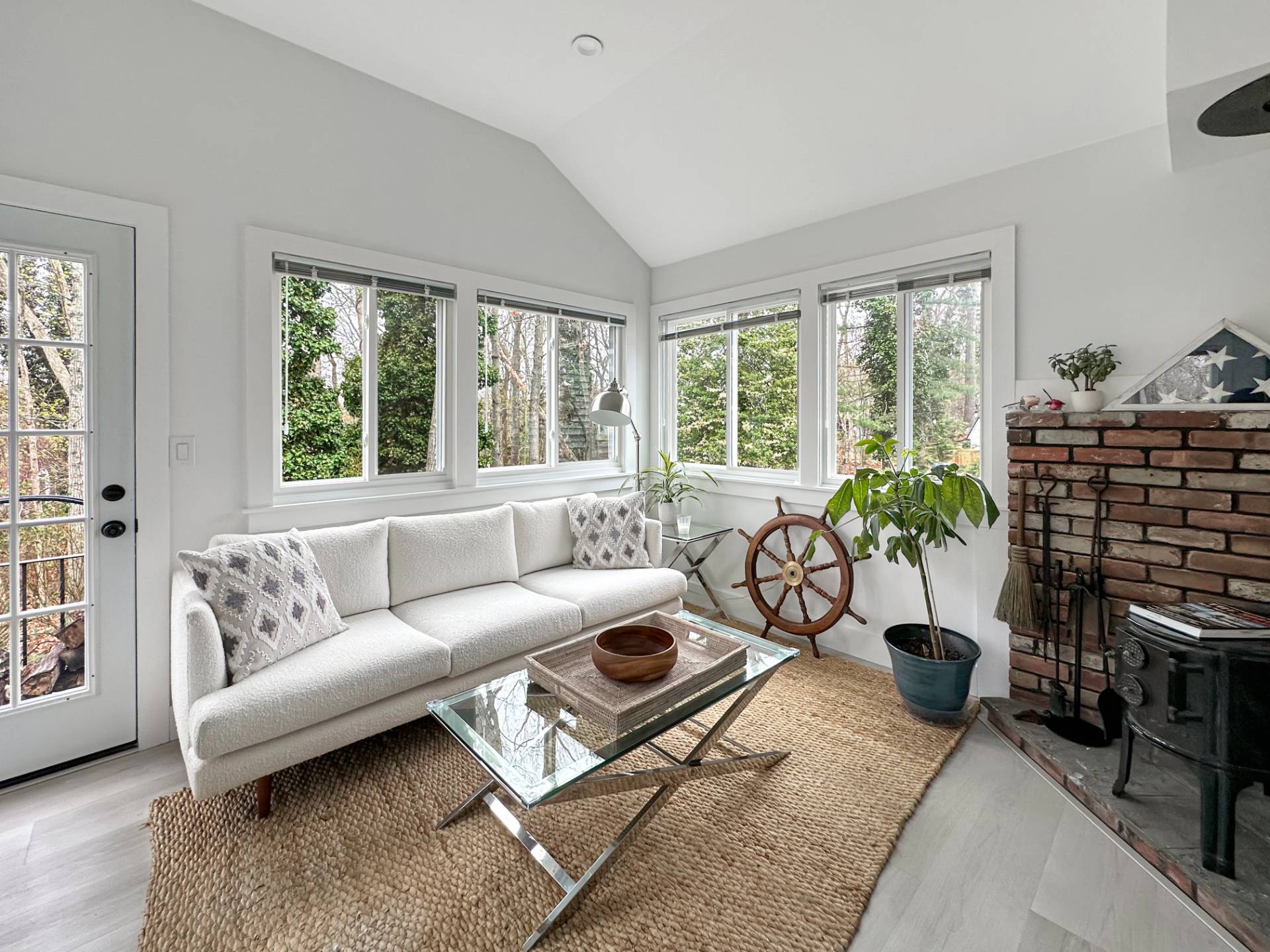 23 Bittersweet Avenue Hampton Bays, NY 11946 - Photo 5 of 17 a living room with furniture potted plant floor and a large window