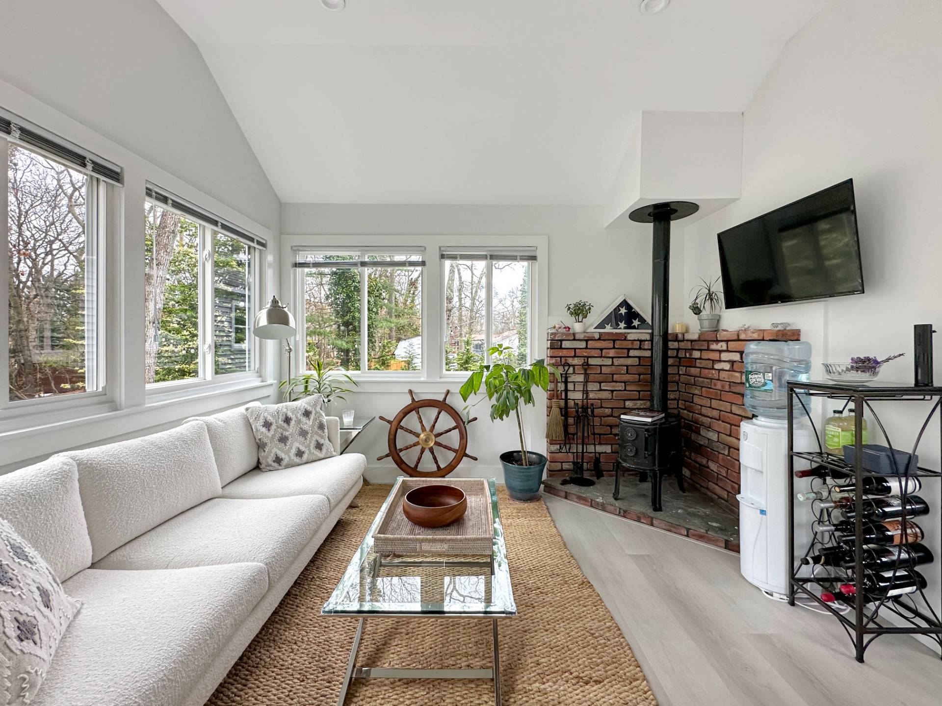 23 Bittersweet Avenue Hampton Bays, NY 11946 - Photo 6 of 17 a living room with furniture and a flat screen tv