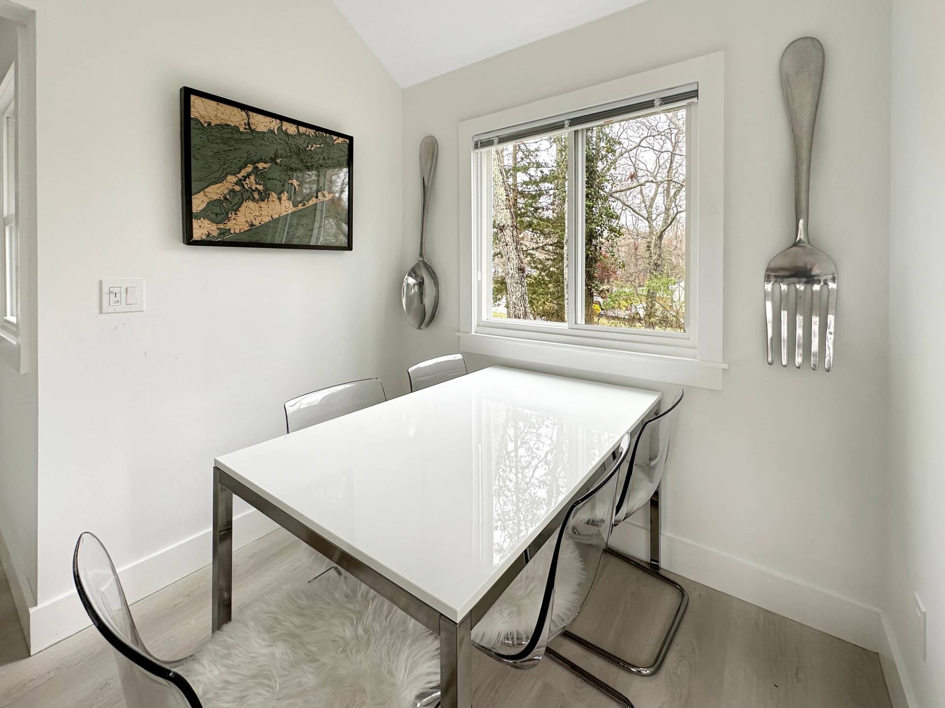 23 Bittersweet Avenue Hampton Bays, NY 11946 - Photo 7 of 17 a view of a workspace with furniture and a window