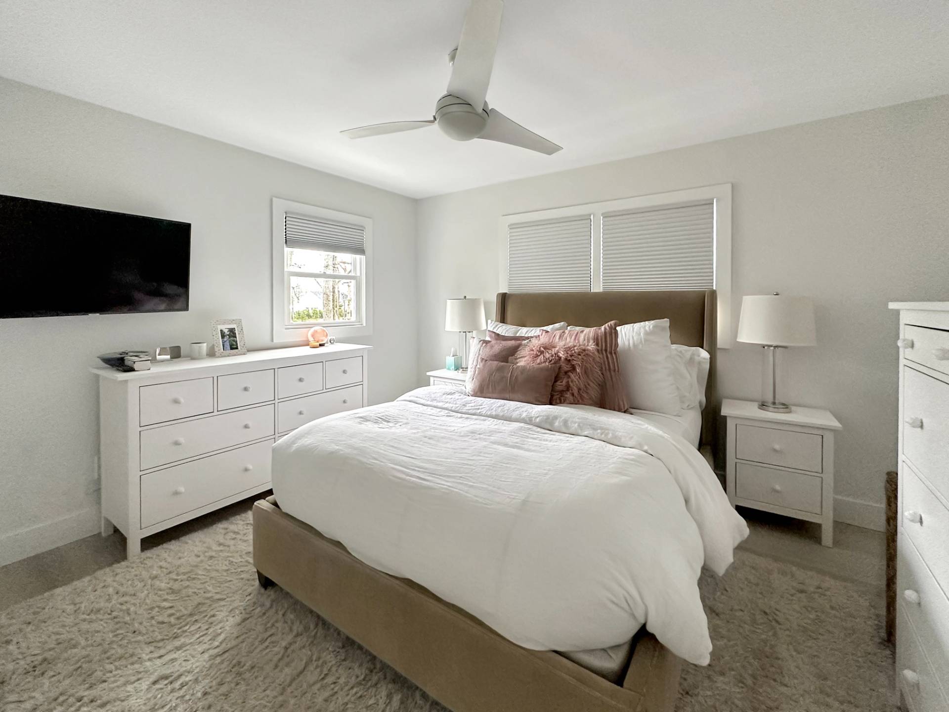 23 Bittersweet Avenue Hampton Bays, NY 11946 - Photo 9 of 17 a bedroom with a bed and a flat screen tv