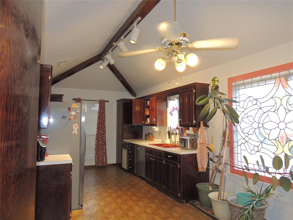 5518 Chimney Rock Road Abilene, TX 79606 - Photo 11 of 29 a kitchen with a sink stove and refrigerator