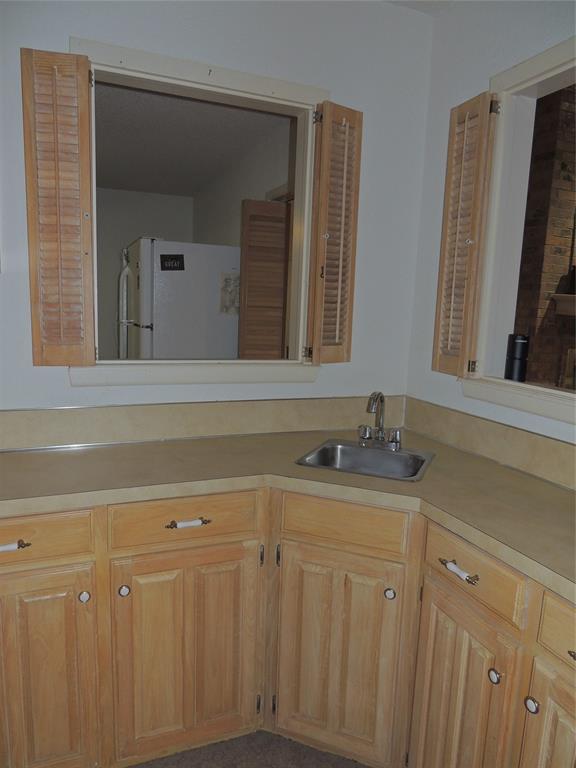 5518 Chimney Rock Road Abilene, TX 79606 - Photo 17 of 29 a bathroom with a sink and a mirror