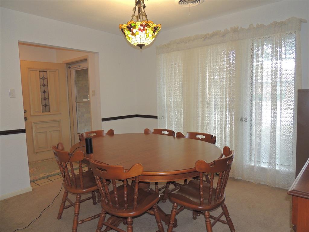 5518 Chimney Rock Road Abilene, TX 79606 - Photo 18 of 29 a dining table with chairs and window