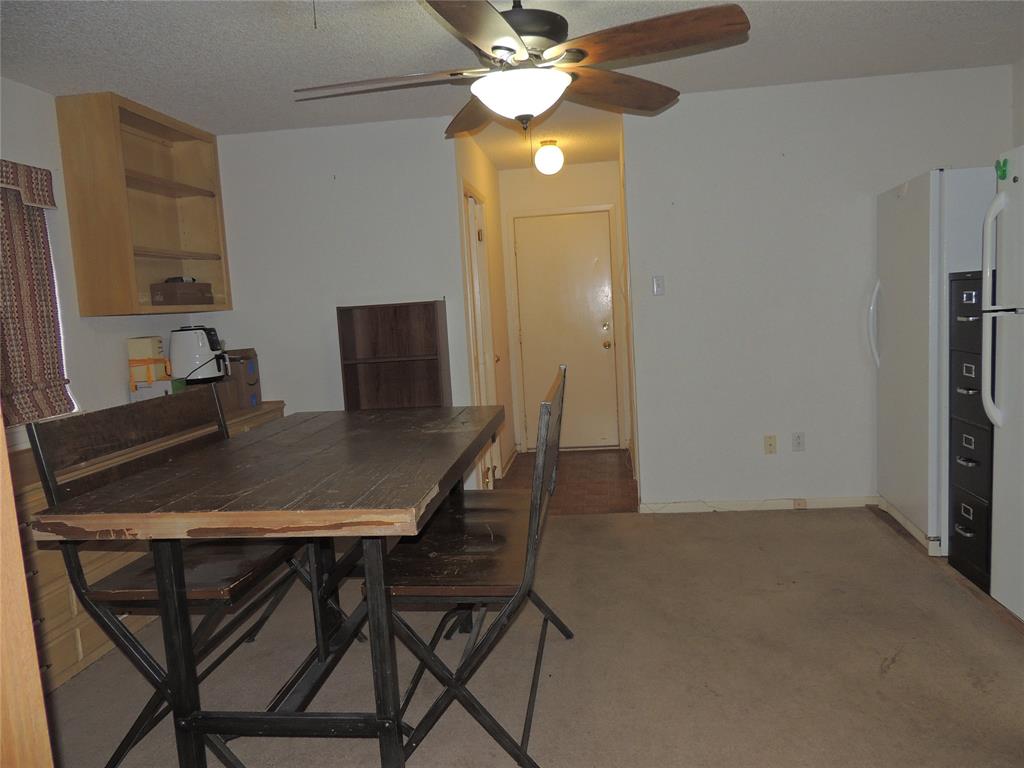 5518 Chimney Rock Road Abilene, TX 79606 - Photo 25 of 29 a view of a dining room with furniture and a chandelier