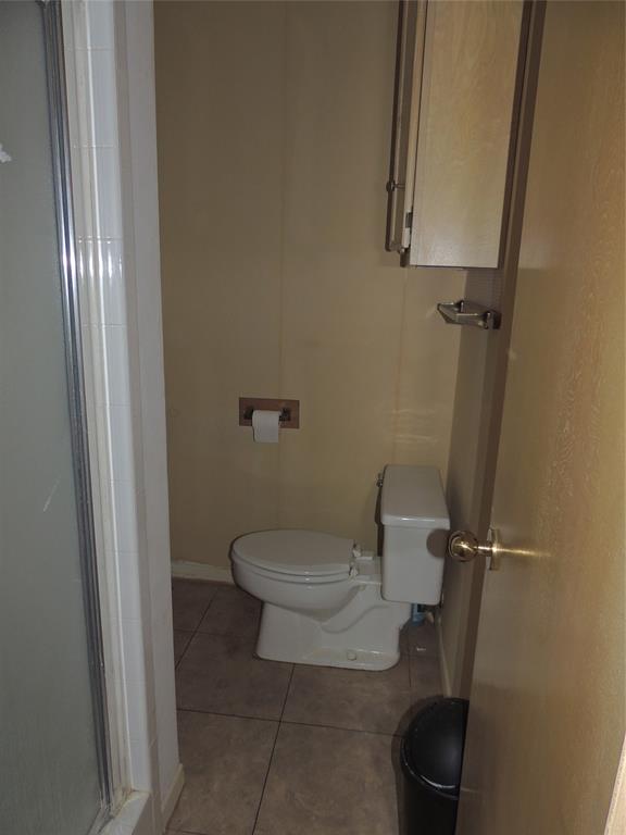 5518 Chimney Rock Road Abilene, TX 79606 - Photo 26 of 29 a white toilet sitting next to a shower