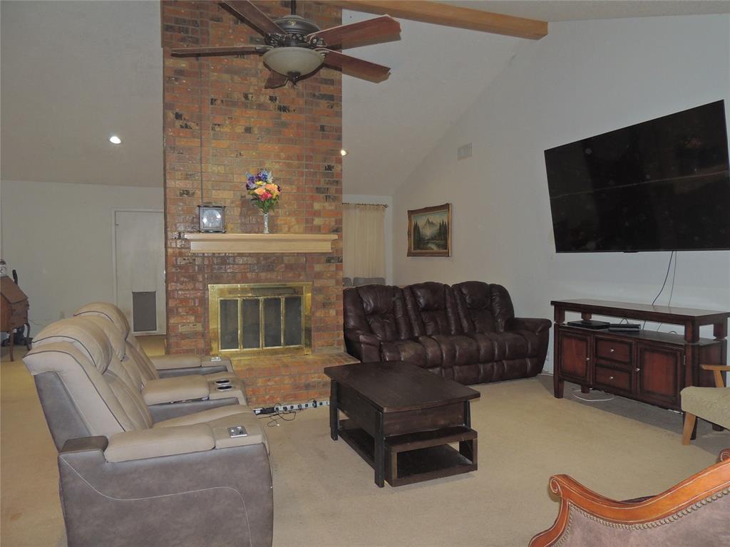5518 Chimney Rock Road Abilene, TX 79606 - Photo 6 of 29 a living room with furniture and a flat screen tv