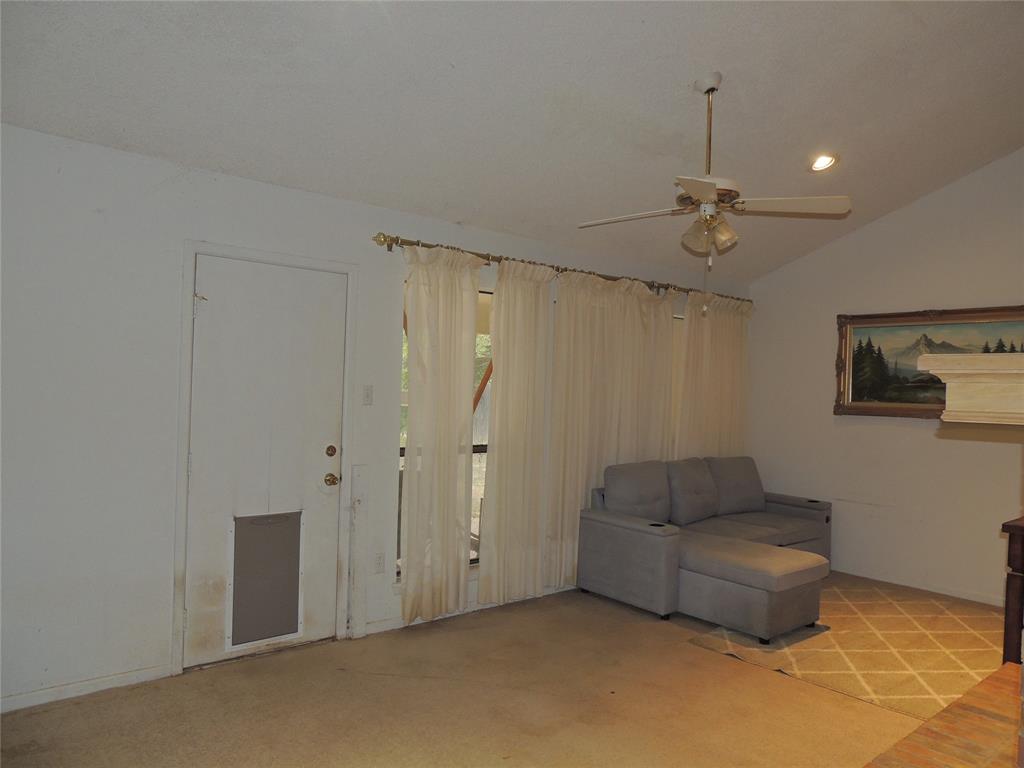 5518 Chimney Rock Road Abilene, TX 79606 - Photo 8 of 29 a living room with furniture and a ceiling fan
