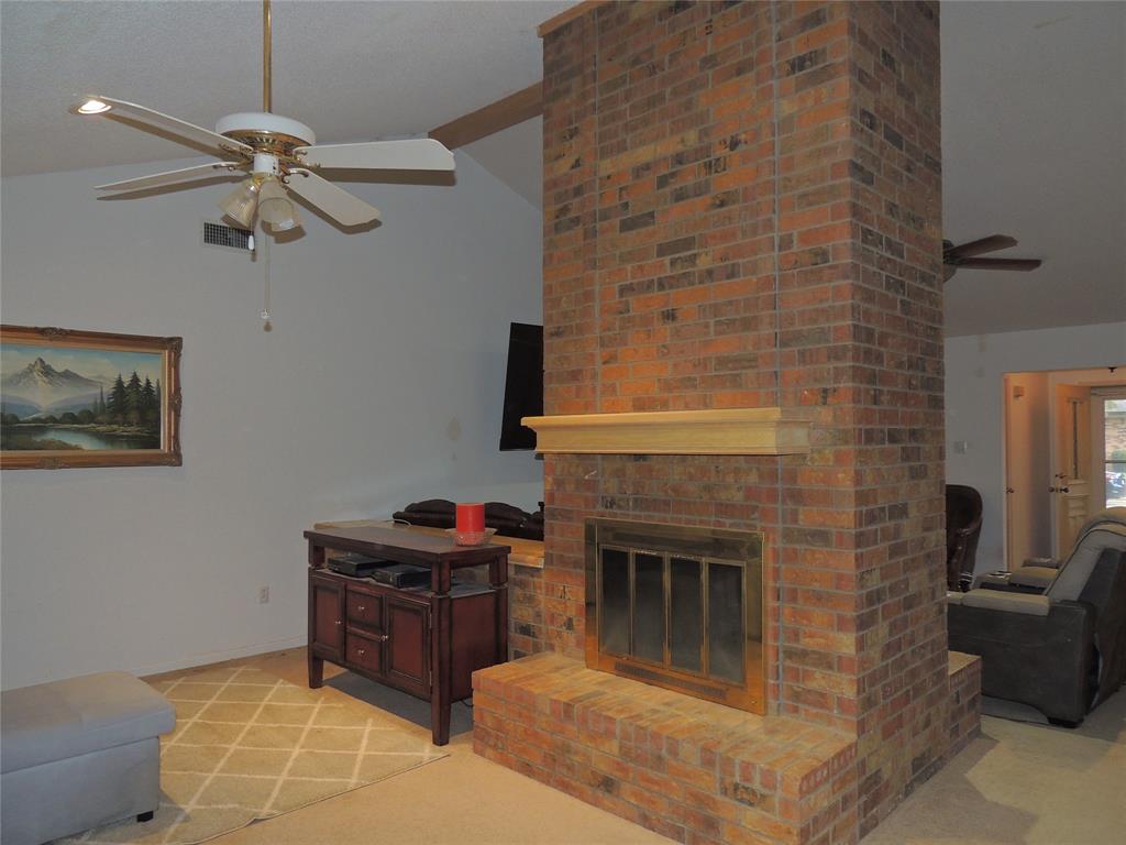 5518 Chimney Rock Road Abilene, TX 79606 - Photo 9 of 29 a living room with furniture and a fireplace