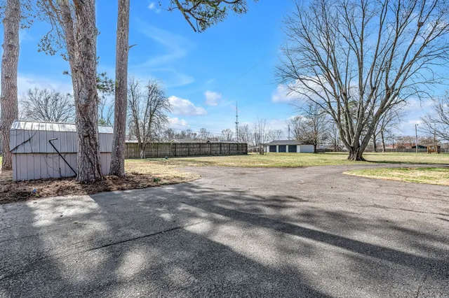 a view of a swimming pool with an outdoor space and seating area