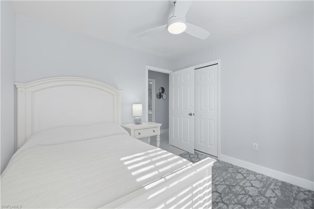 3605 Corinthian Way Naples, FL 34105 - Photo 15 of 33 a large white bed in a white room