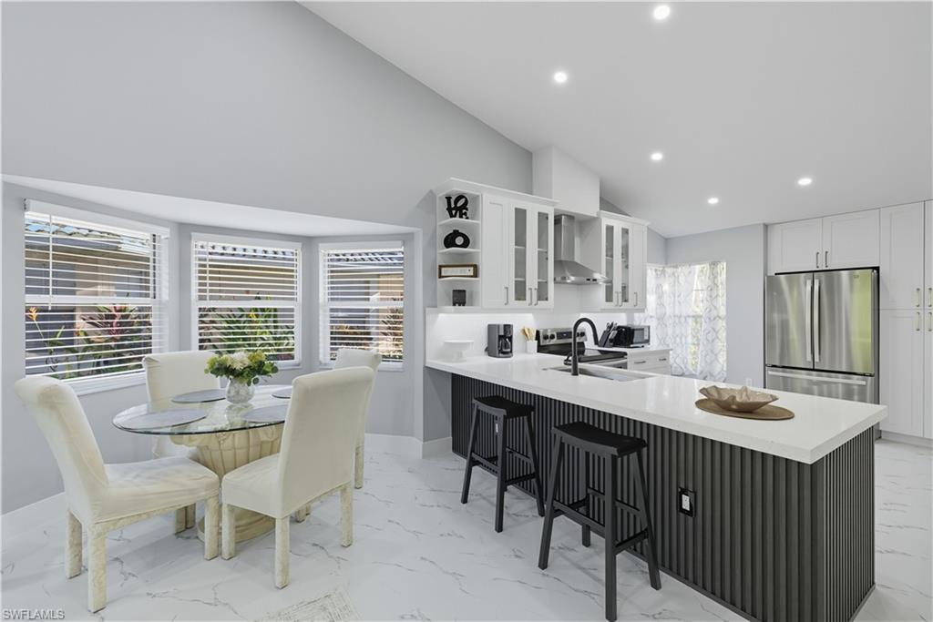 3605 Corinthian Way Naples, FL 34105 - Photo 3 of 33 a view of kitchen with breakfast area