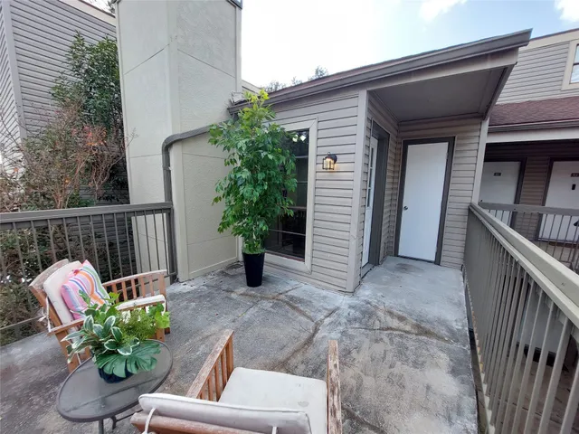 a view of a porch with furniture
