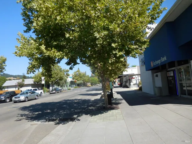 a view of street with parked cars