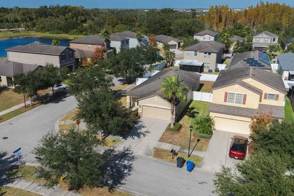 an aerial view of residential houses with outdoor space