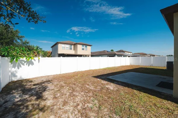 a view of a backyard of the house