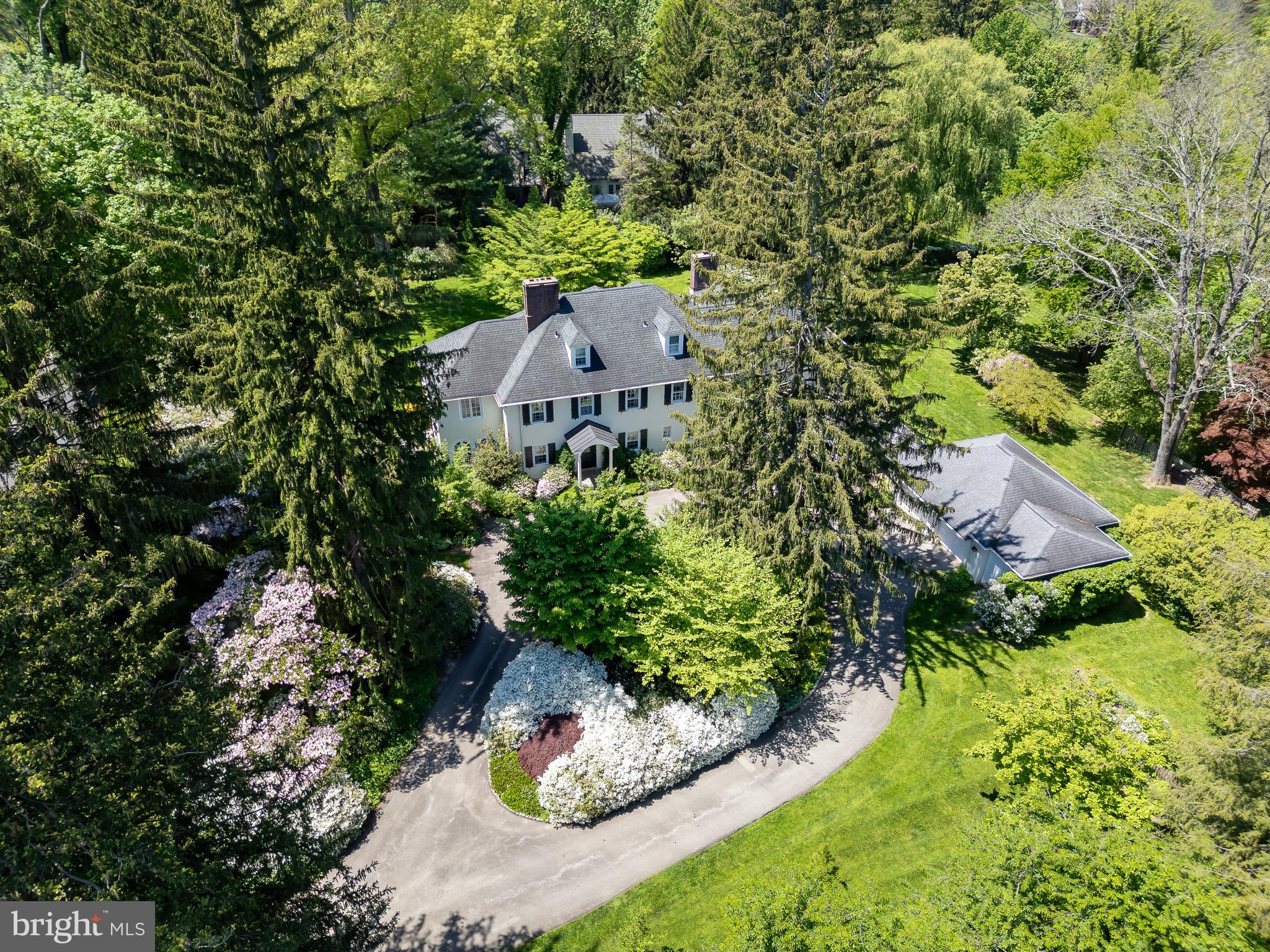 750 Harrison Road Villanova, PA 19085 - Photo 1 of 43 an aerial view of a house with a yard and large trees