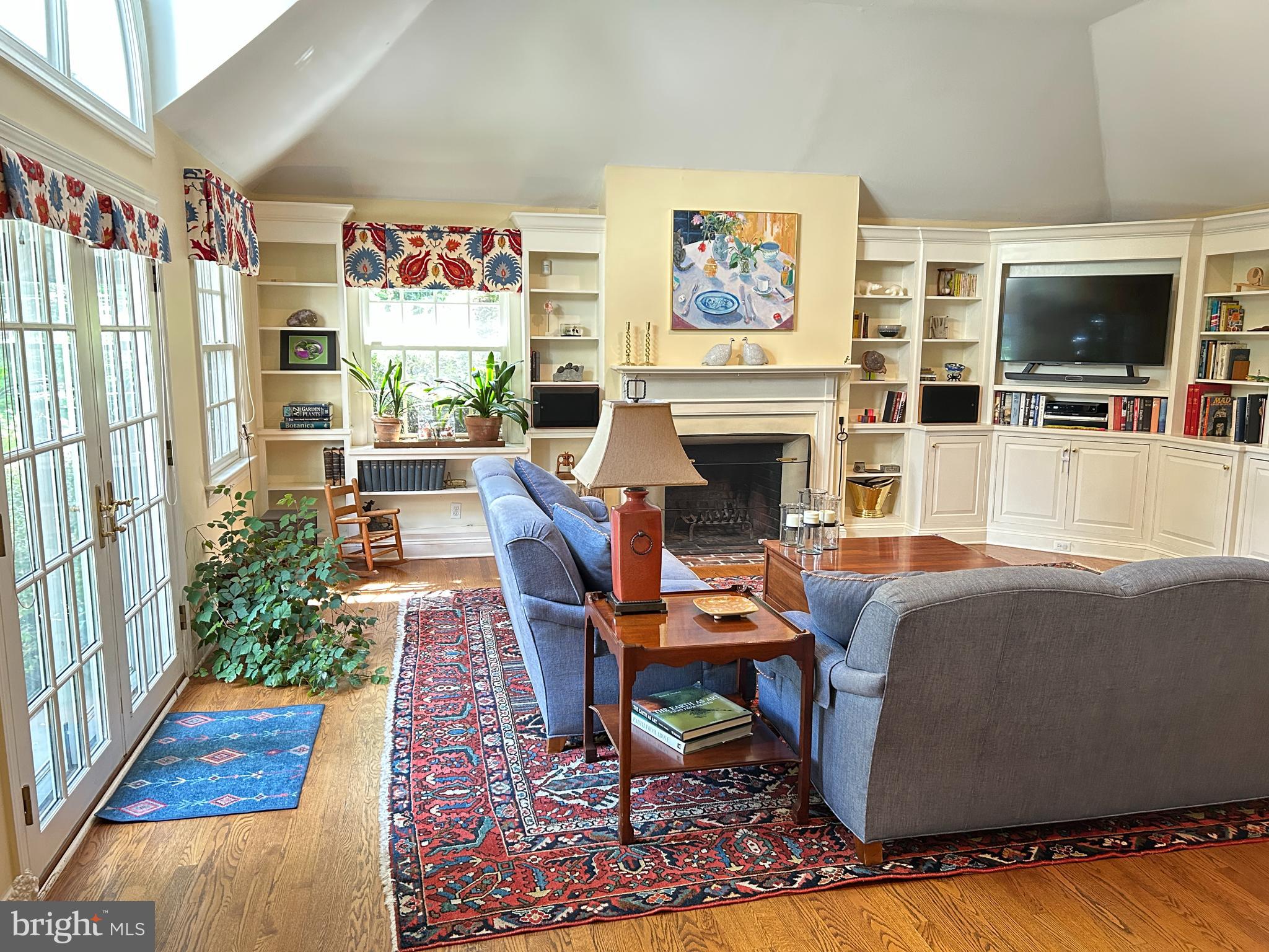750 Harrison Road Villanova, PA 19085 - Photo 26 of 43 a living room with furniture a flat screen tv and a fireplace