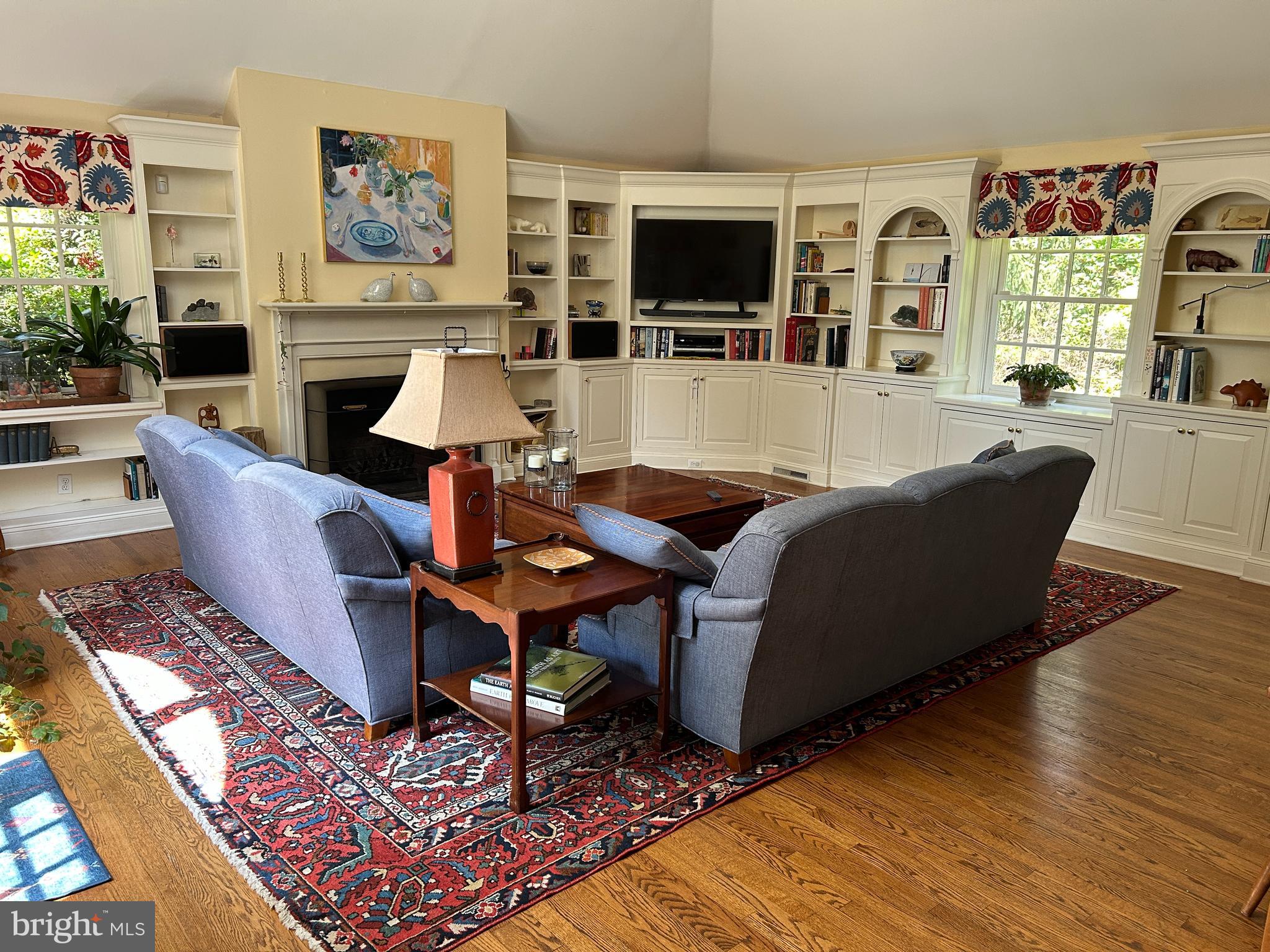 750 Harrison Road Villanova, PA 19085 - Photo 29 of 43 a living room with furniture a flat screen tv and a fireplace