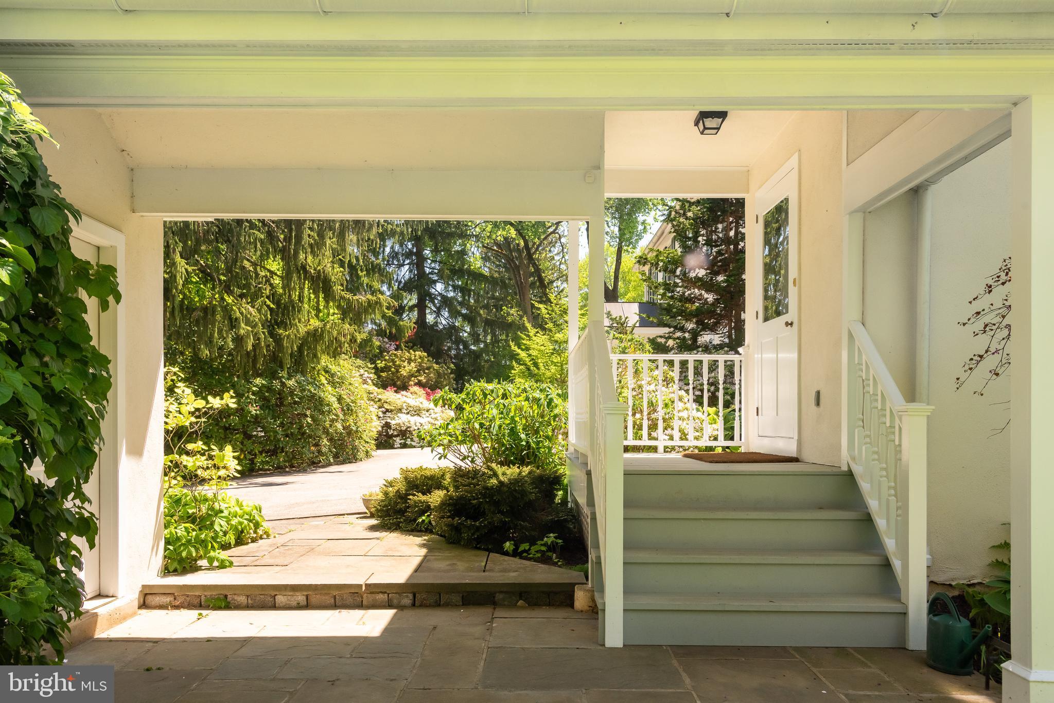750 Harrison Road Villanova, PA 19085 - Photo 33 of 43 a front view of a house with a garden