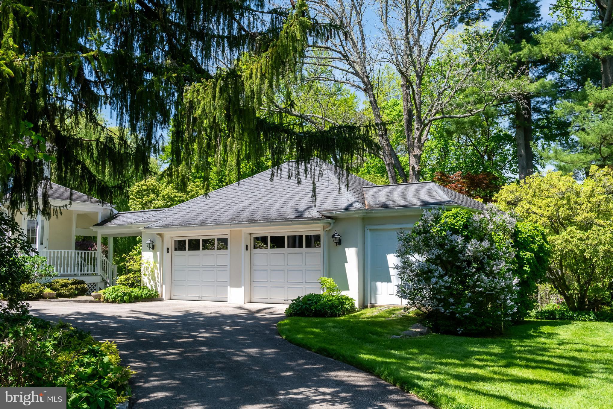 750 Harrison Road Villanova, PA 19085 - Photo 34 of 43 a front view of a house with a garden