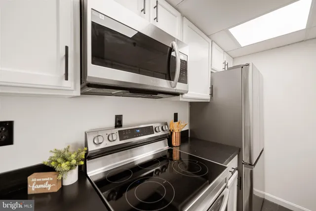 a kitchen with a stove and a microwave