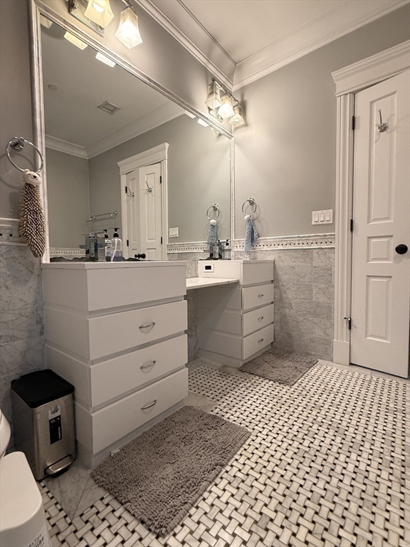 161 Tudor Street, Unit 3 Boston, MA 02127 - Photo 11 of 27 a bathroom with a sink a toilet a mirror and shower