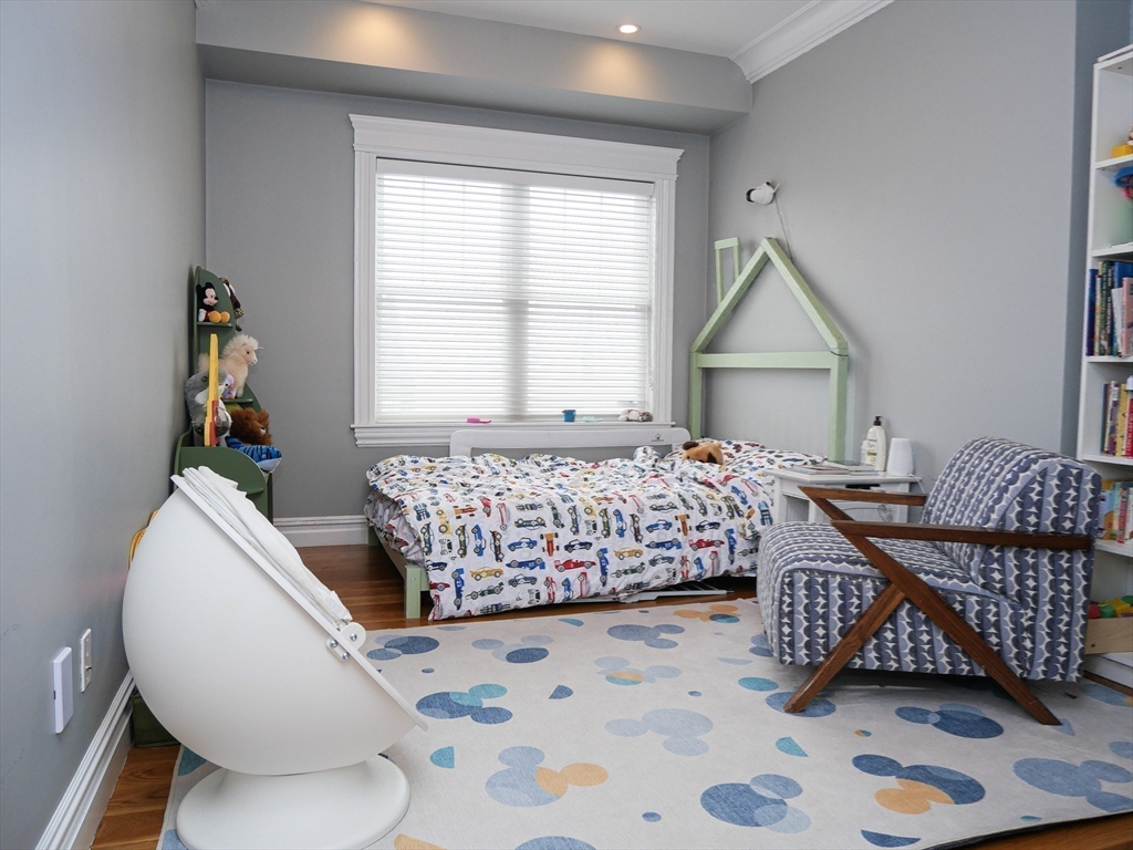 161 Tudor Street, Unit 3 Boston, MA 02127 - Photo 15 of 27 a bedroom with bed and a window