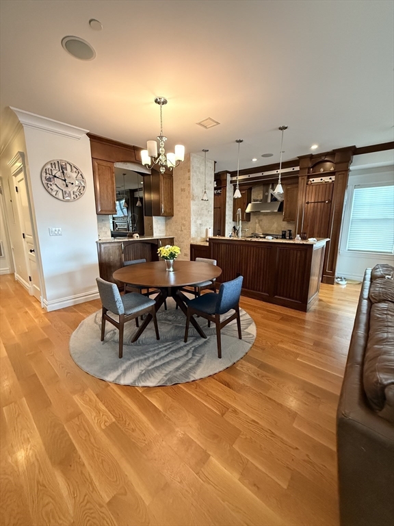 161 Tudor Street, Unit 3 Boston, MA 02127 - Photo 3 of 27 a living room with furniture and wooden floor