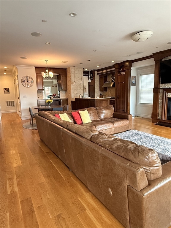 161 Tudor Street, Unit 3 Boston, MA 02127 - Photo 5 of 27 a living room with furniture and a flat screen tv