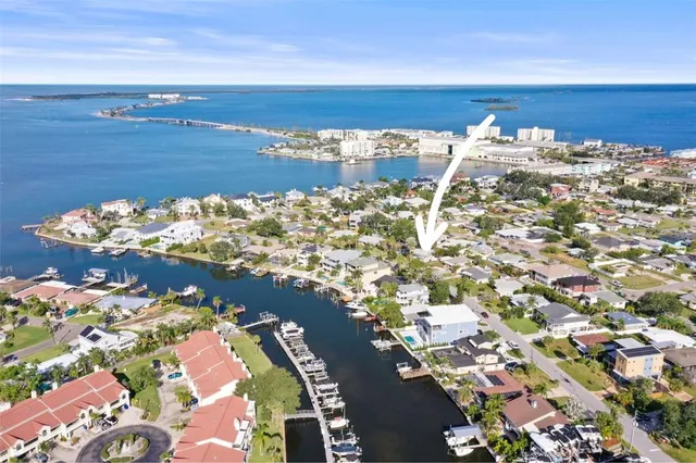 a view of a dining room with furniture and a clock