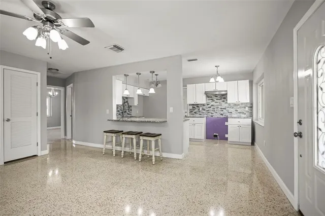 a view of an empty room with stairs