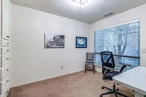 a view of a workspace with furniture