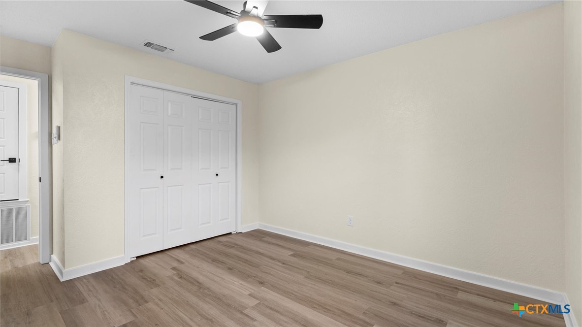 300 Ridge Crest Drive Seguin, TX 78155 - Photo 11 of 33 wooden floor in an empty room